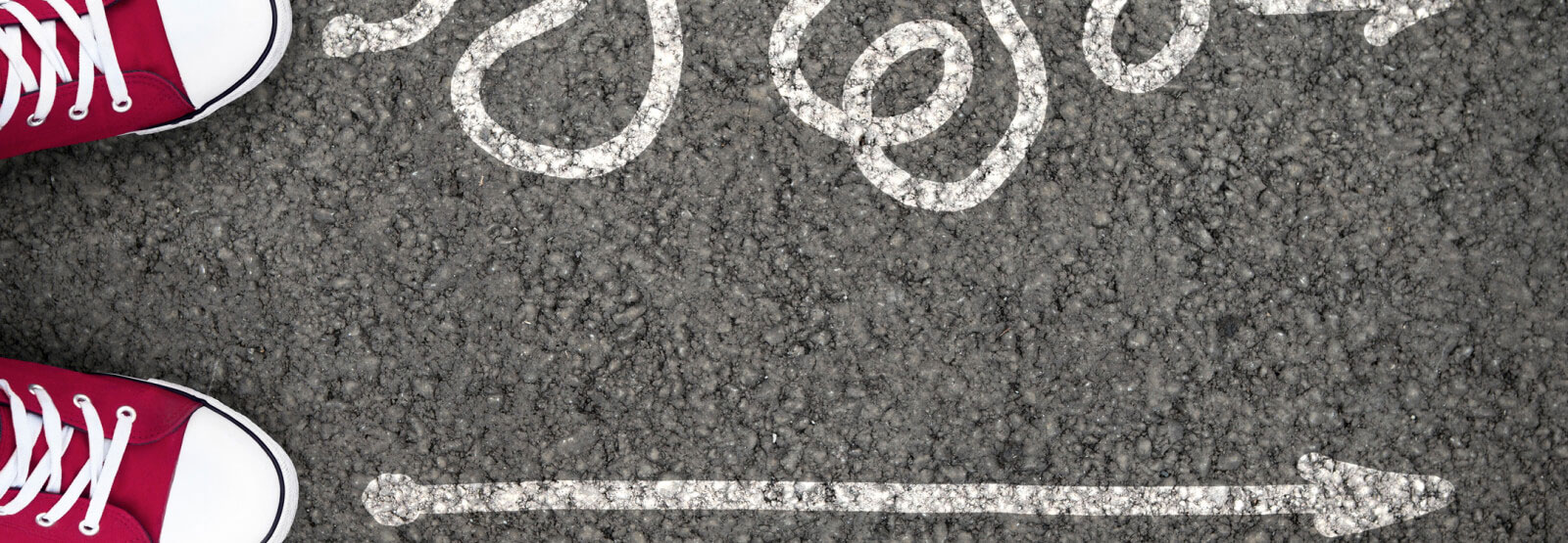 top-down view of shoes on pavement